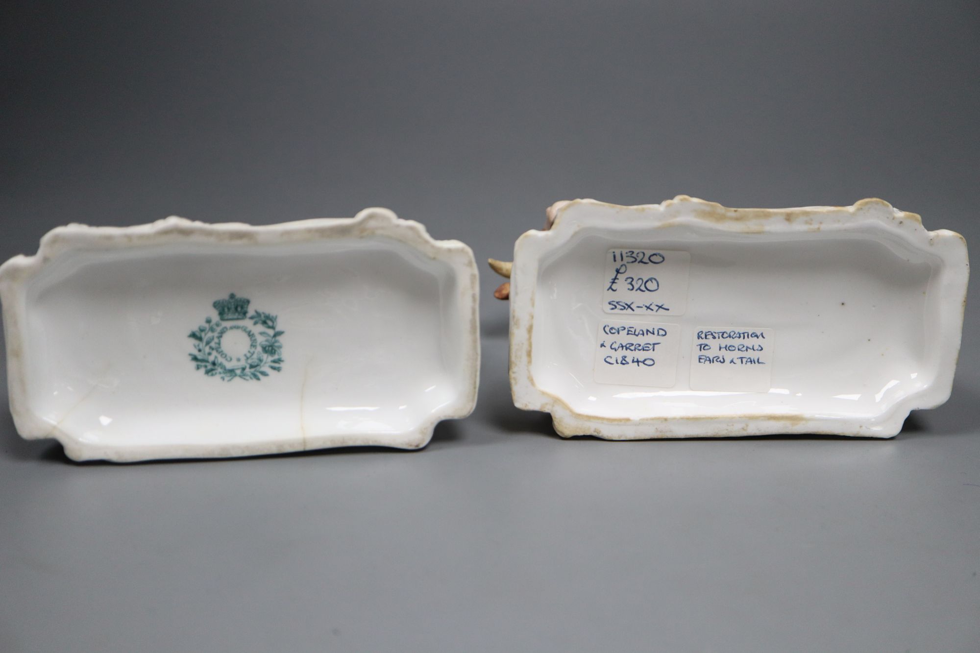 Two rare Copeland & Garrett porcelain recumbent figures of bulls, c.1833-47, 12.5cm long,